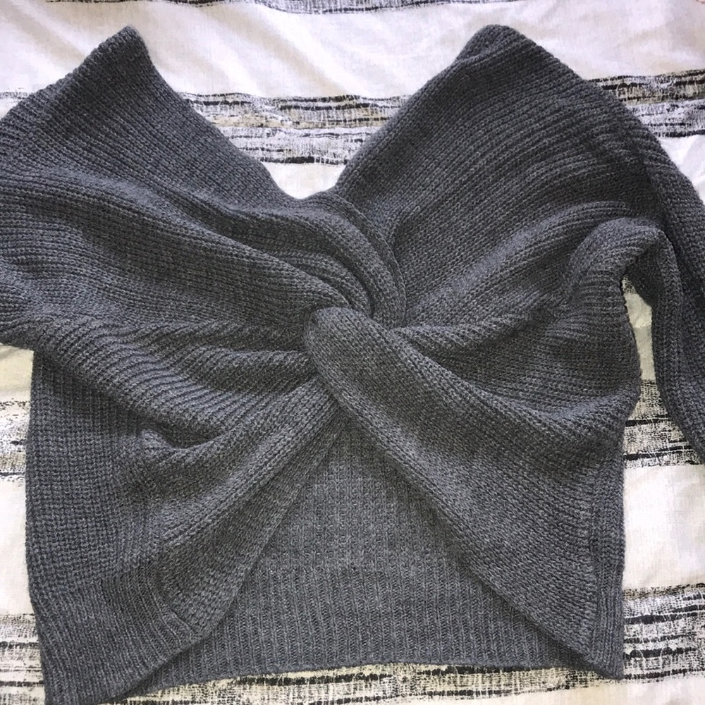 Women’s grey sweater with open back